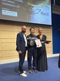Hactl Chief Executive Wilson Kwong (center) receives the award from Thilo Schmid, CEO, Cologne Bonn Airport (left).