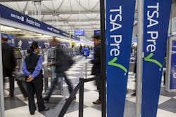 Passengers walk through the entrance of a TSA PreCheck in at O'Hare International Airport in 2017 in Chicago. Passengers walk through the entrance of a TSA PreCheck in at O'Hare International Airport in 2017 in Chicago.