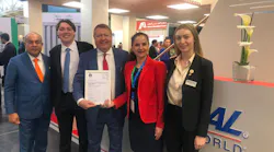 Zheni Chaneva, Project Manager Lithium Batteries Certification, IATA, presenting the CEIV Lithium Batteries Certificate to Chris Alf, Chairman, National Air Cargo Holdings, Inc. at National Airlines exhibition booth during the Air Cargo Europe event.