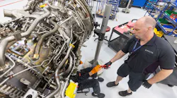 Airframe and Power Plant mechanics work on a Gear Turbine engine in Delta's new facility Tuesday, Feb. 7, 2023.