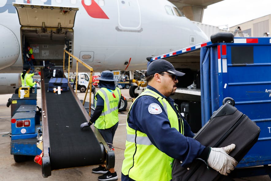 Members of the ground crew unload baggage from an American Airlines flight from Grand Rapids, MI on Tuesday, May 9, 2023 at DFW Airport.