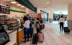 People purchase food in Terminal A in the Sacramento International Airport in 2021. As part of a remake of the airport s concession program, there will be spaces for 18 eateries food concepts in both airport terminals. Officials plan farm-to-folk options, Asian eateries and more budget friendly choices.