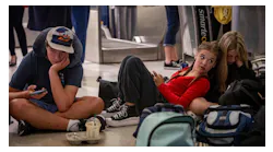 Miami, Florida - June 20, 2023 - Stranded Middle School students pass away the time on their phones at MIA . A group of Middle school students from Reno, Nevada missed their connection to Costa Rica last night after their flight to Miami was diverted to Tampa due to thunderstorms.