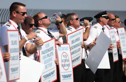 Southwest Airlines pilots drink water while picketing for better work conditions on June 21, 2022, outside Dallas Love Field. Southwest Airlines pilots drink water while picketing for better work conditions on June 21, 2022, outside Dallas Love Field.
