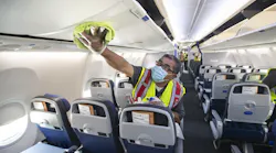 Cleaning supervisor Jose Mendoza disinfects a United Airlines jet cabin before passengers are allowed to board at LAX on July 9, 2020 in Los Angeles. Reauthorization of the FAA is one of the more pressing issues on the to-do list for Congress this summer.