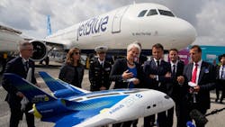 French President Emmanuel Macron, middle, and Airbus CEO Guillaume Faury, right, look at the concept hybrid-hydrogen aircraft Airbus Zero during the International Paris Air Show at the Paris-Le Bourget Airport on June 19, 2023. French President Emmanuel Macron, middle, and Airbus CEO Guillaume Faury, right, look at the concept hybrid-hydrogen aircraft Airbus Zero during the International Paris Air Show at the Paris-Le Bourget Airport on June 19, 2023.