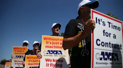 Aircraft Mechanics Fraternal Association Local 11, Southwest Airlines flight Attendants' Union and Southwest Airlines Pilots' Association picket for contract negotiations at the entrance to Love Field in Dallas Friday July 22, 2016. Airline labor relations are governed by the Railway Labor Act.