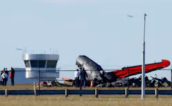 Damage from a midair collision between two planes sits within the fence line of the Dallas Executive Airport on Nov. 12. Damage from a midair collision between two planes sits within the fence line of the Dallas Executive Airport on Nov. 12.