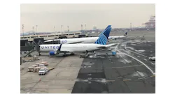 Two United Airlines jets are seen at Newark Airport's Terminal B. The airline will be the first to equip it's entire mainline fleet with Braille seat markers and other signs to help passengers.