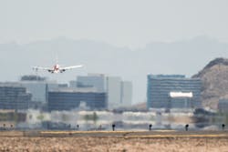 An airplane approaches the runway at the Phoenix Sky Harbor International Airport during a heat wave on July 15, 2023, in Phoenix. Weather forecasts today are expecting temperatures to reach 115 degrees. The Phoenix area is grappling with record-breaking temperatures as prolonged heat waves continue soaring across the Southwest. An airplane approaches the runway at the Phoenix Sky Harbor International Airport during a heat wave on July 15, 2023, in Phoenix. Weather forecasts today are expecting temperatures to reach 115 degrees. The Phoenix area is grappling with record-breaking temperatures as prolonged heat waves continue soaring across the Southwest.