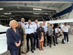 Boeing leaders present a check to Fly Compton. Funds will go toward flight training classes offered to underserved students in LA’s Compton community. Boeing leaders present a check to Fly Compton. Funds will go toward flight training classes offered to underserved students in LA’s Compton community.