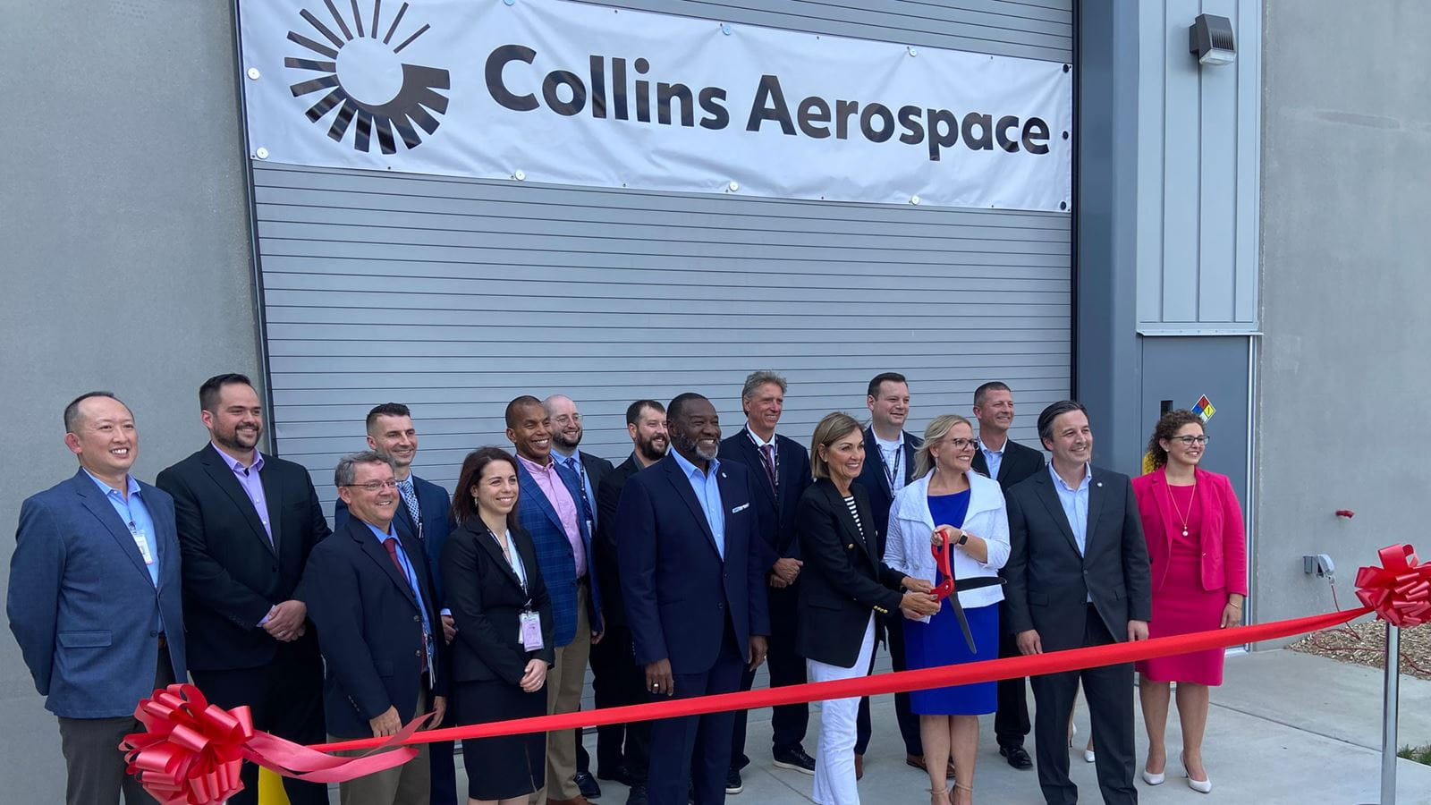 Collins Aerospace leaders join with Iowa Governor Kim Reynolds to cut the ribbon on a $14 million additive manufacturing center expansion at the company's facility in West Des Moines.