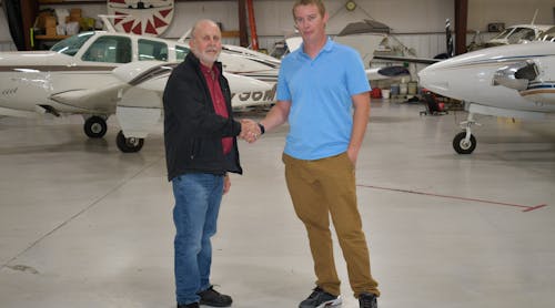 Howard Siedlecki, former owner of Sunshine Aviation Services, with current owner Patrick Peterson (pictured at right).