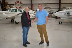Howard Siedlecki, former owner of Sunshine Aviation Services, with current owner Patrick Peterson (pictured at right).
