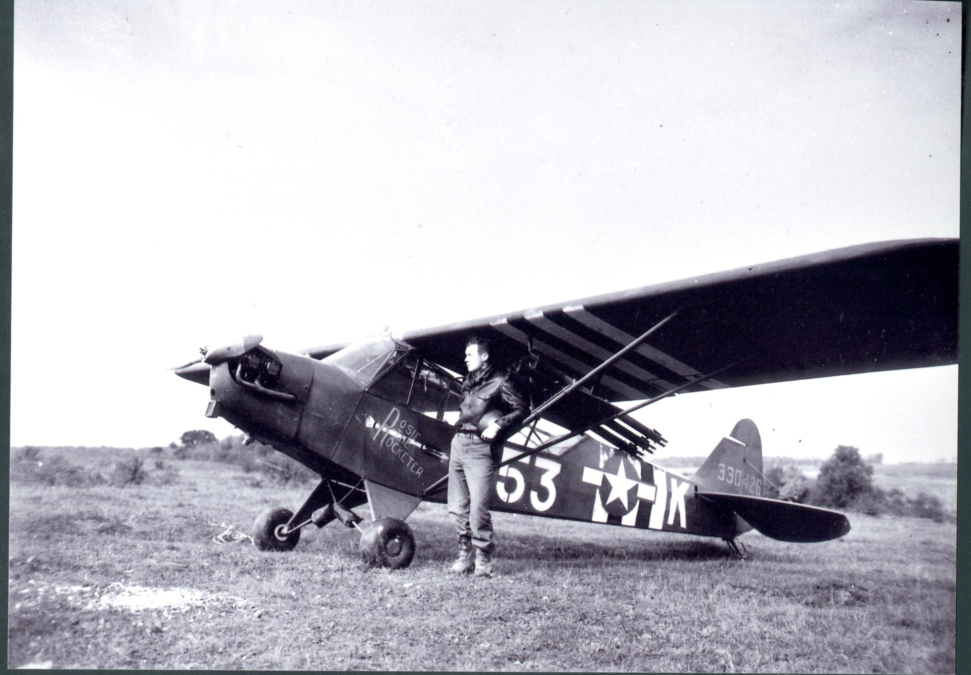 Maj. Charles Carpenter with the Piper L-4 'Rosie the Rocketer' during WWII
