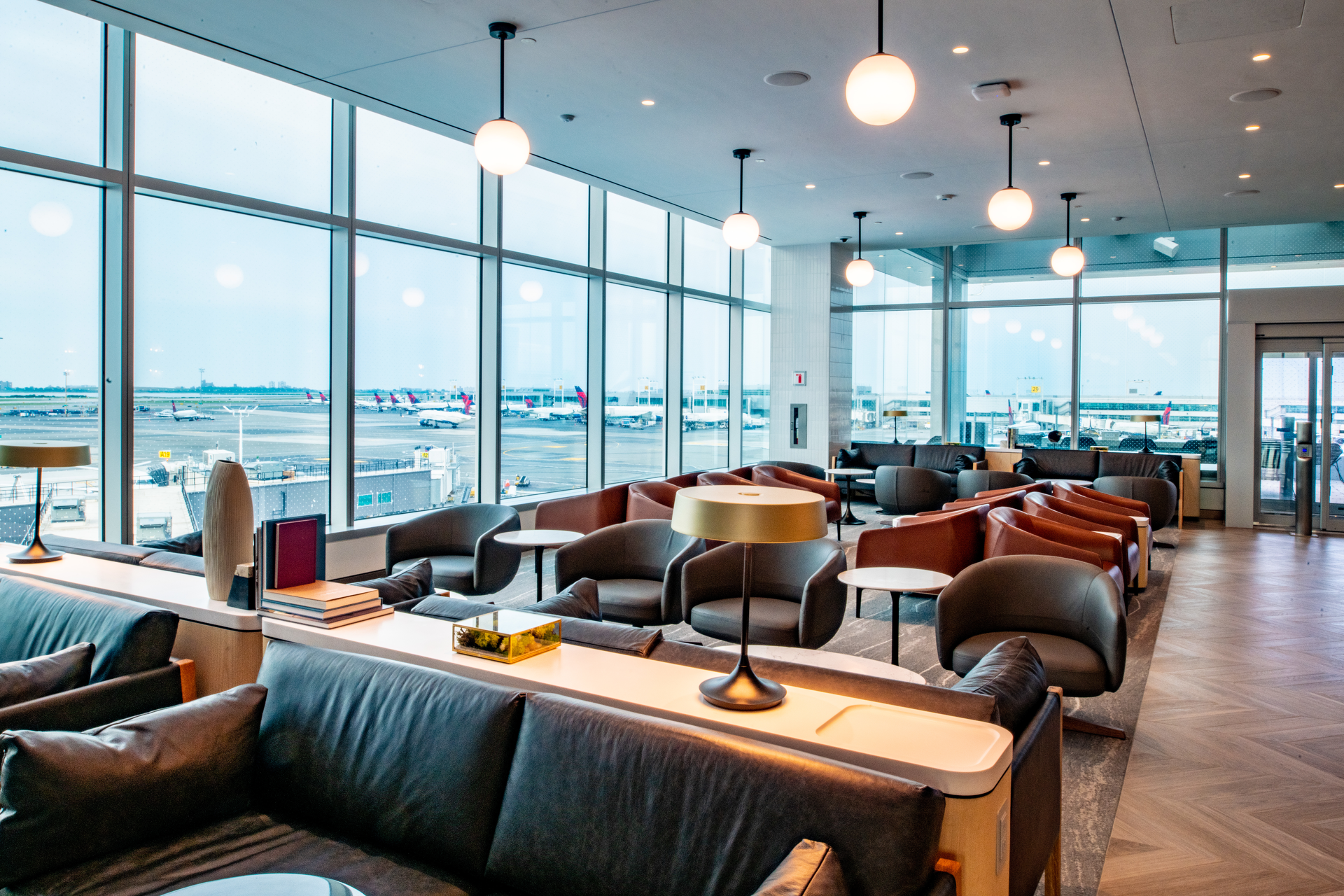 The nearly 14,000-square-foot Club seats more than 250 guests and includes sweeping views of the airfield.
