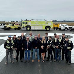 In California, the County of Humboldt&apos;s Department of Aviation staff gather on the freshly repaved runway at the California Redwood Coast-Humboldt County Airport.