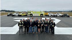 In California, the County of Humboldt&apos;s Department of Aviation staff gather on the freshly repaved runway at the California Redwood Coast-Humboldt County Airport.