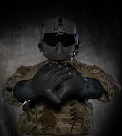 Staff Sgt. Dylan Metcalf, 54th Helicopter Squadron flight engineer, poses with a pair of heated glove prototypes being tested by Minot Air Force Base, N.D., July 28, 2023. The 54th HS can work up to approximately 10,000 feet where temperatures can be extremely low, requiring the highest level of cold-weather equipment to stay warm and offset hypothermia. Staff Sgt. Dylan Metcalf, 54th Helicopter Squadron flight engineer, poses with a pair of heated glove prototypes being tested by Minot Air Force Base, N.D., July 28, 2023. The 54th HS can work up to approximately 10,000 feet where temperatures can be extremely low, requiring the highest level of cold-weather equipment to stay warm and offset hypothermia.