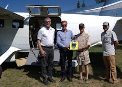Delivering the Daher-sponsored ZOLL 3 defibrillator to Cavanaugh Bay with the Kodiak 100 are: Nicolas Chabbert, Senior Vice President of Daher&rsquo;s Aircraft Division and CEO of Kodiak Aircraft (second from left); with David Schuck, Senior Advisor at Kodiak Aircraft (at left). They are joined by Sam Perez, organizer of the Backcountry Aviation Defibrillator Project (at right); and Don McIntosh, District 1 Director for the Idaho Aviation Association.