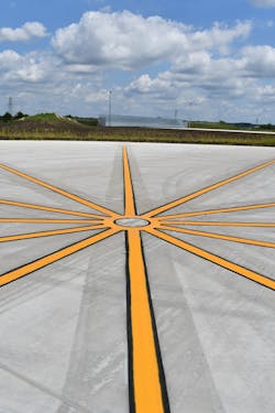 Compass Calibration Pad with the Ground Engine Run-Up wall in the background. Compass Calibration Pad with the Ground Engine Run-Up wall in the background.