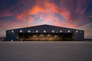 B. Coleman Aviation hangar at sunset.