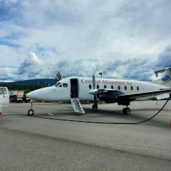 A Tahltan Nation Development Corporation (TNDC) Airport Services employee refuels a charter aircraft at the Dease Lake Airport (CYDL).