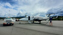 A Tahltan Nation Development Corporation (TNDC) Airport Services employee refuels a charter aircraft at the Dease Lake Airport (CYDL). A Tahltan Nation Development Corporation (TNDC) Airport Services employee refuels a charter aircraft at the Dease Lake Airport (CYDL).