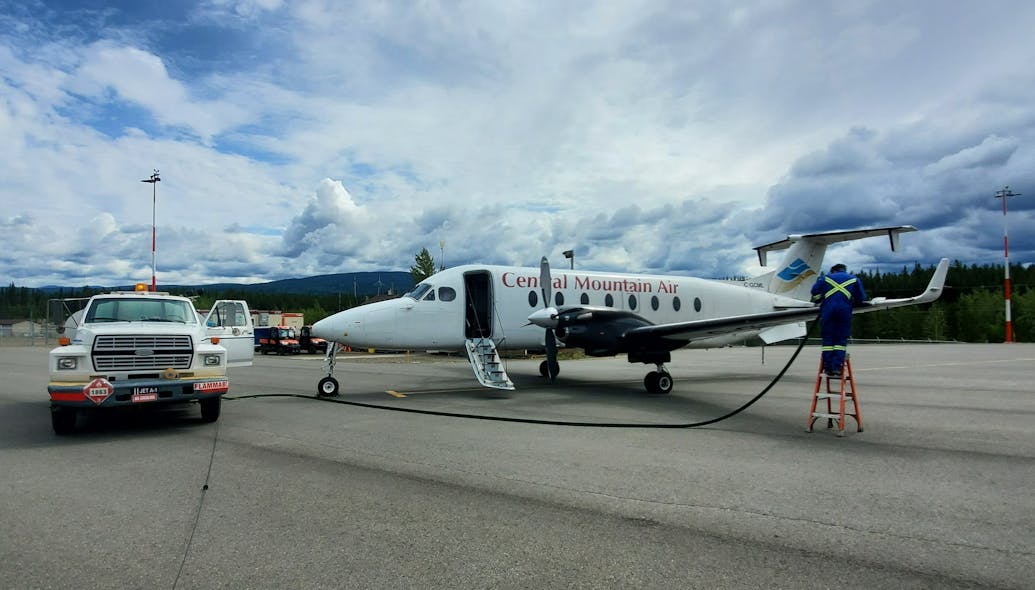 A Tahltan Nation Development Corporation (TNDC) Airport Services employee refuels a charter aircraft at the Dease Lake Airport (CYDL).