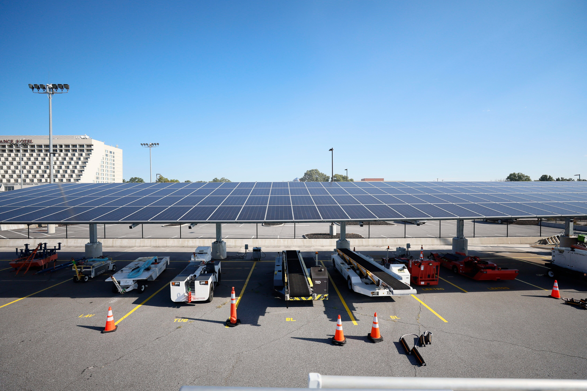Installed by Cherry Street Energy in 2021, solar panels are seen at Signature Flight Support at Hartsfield-Jackson Atlanta International Airport on Thursday, Sep. 7, 2023. The city of Atlanta plans to contract Cherry Street Energy to install solar panels to help power airport buildings.
