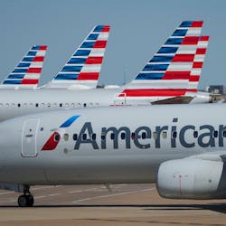 American Airlines planes are seen at the gates of Terminal C at DFW Airport on Oct. 16, 2021, in Dallas.