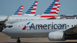 American Airlines planes are seen at the gates of Terminal C at DFW Airport on Oct. 16, 2021, in Dallas.