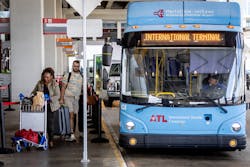 Passengers board the terminal-to-terminal shuttle at the international terminal on Tuesday, Sept. 29, 2023.