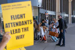A family, entering the airport, looks at one of several United Airlines flight attendant picket lines protesting unfair working conditions for United Airlines Flight Attendants outside Terminal C of Newark Liberty International Airport on Tuesday, September 27, 2022. Flight attendants returned to the airport on Oct. 26, 2023 as part of a national protest over the state of contract negotiations with United.