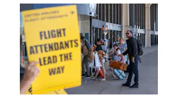 A family, entering the airport, looks at one of several United Airlines flight attendant picket lines protesting unfair working conditions for United Airlines Flight Attendants outside Terminal C of Newark Liberty International Airport on Tuesday, September 27, 2022. Flight attendants returned to the airport on Oct. 26, 2023 as part of a national protest over the state of contract negotiations with United.