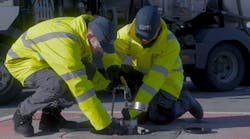 A step in the current process for pit valve integrity testing, which involves lifting the pit lid and inserting coupler fitted with a pressure gauge, pressure bleed valve and stainless steel bucket. A step in the current process for pit valve integrity testing, which involves lifting the pit lid and inserting coupler fitted with a pressure gauge, pressure bleed valve and stainless steel bucket.