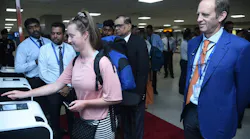 Passengers try out SriLankan Airlines’ new self-service channel in the departure terminal of Bandaranaike International Airport as officials of the airline and airport and aviation services watch on following the channel’s launch on Nov. 14, 2023.