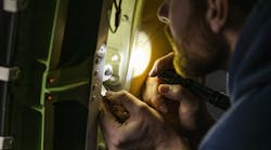 Alaska Airlines maintenance technicians inspect a Boeing 737-MAX 9 door plug prior to the aircraft returning to service. Photographed January 26, 2024 at Seattle-Tacoma International Airport (SEA) by Ingrid Barrentine / Alaska Airlines.