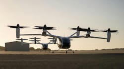 Two of Joby’s prototype electric air taxi aircraft at the company’s flight test and manufacturing facilities in Marina, California. Two of Joby’s prototype electric air taxi aircraft at the company’s flight test and manufacturing facilities in Marina, California.
