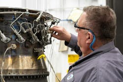 A Pratt & Whitney engineer inspects a full annular combustor rig at the company’s test facility in Middletown, Connecticut. A Pratt & Whitney engineer inspects a full annular combustor rig at the company’s test facility in Middletown, Connecticut.