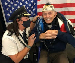 Capt. Grechman and Naval Chief Petty Officer Higgins in 2021 flying home after being an honored guest at the Pearl Harbor 80th anniversary commemorative ceremony.