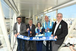 Miami-Dade County Mayor Daniella Levine-Cava (center), Miami-Dade County Chief Operating Officer Jimmy Morales (second from left) and Miami International Airport Director Ralph Cutie (second from right) cut the ceremonial ribbon.
