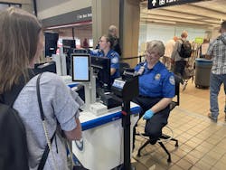 A traveler waits while the tablet captures her photo to immediately verify that her face matches the face on her ID. A traveler waits while the tablet captures her photo to immediately verify that her face matches the face on her ID.
