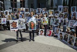 People hold signs during a vigil for victims of the Ethiopian Airlines Flight ET302 crash on Sept. 10, 2019, in Washington, D.C. The March 10, 2019, crash killed 157 people. People hold signs during a vigil for victims of the Ethiopian Airlines Flight ET302 crash on Sept. 10, 2019, in Washington, D.C. The March 10, 2019, crash killed 157 people.
