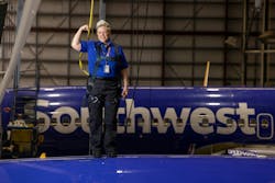 Jennifer Morgan, aircraft maintenance inspector, posed for a photo on top of a plane in Hangar 5 at the Southwest Airlines Headquarters in Dallas on April 14, 2023. Jennifer Morgan, aircraft maintenance inspector, posed for a photo on top of a plane in Hangar 5 at the Southwest Airlines Headquarters in Dallas on April 14, 2023.