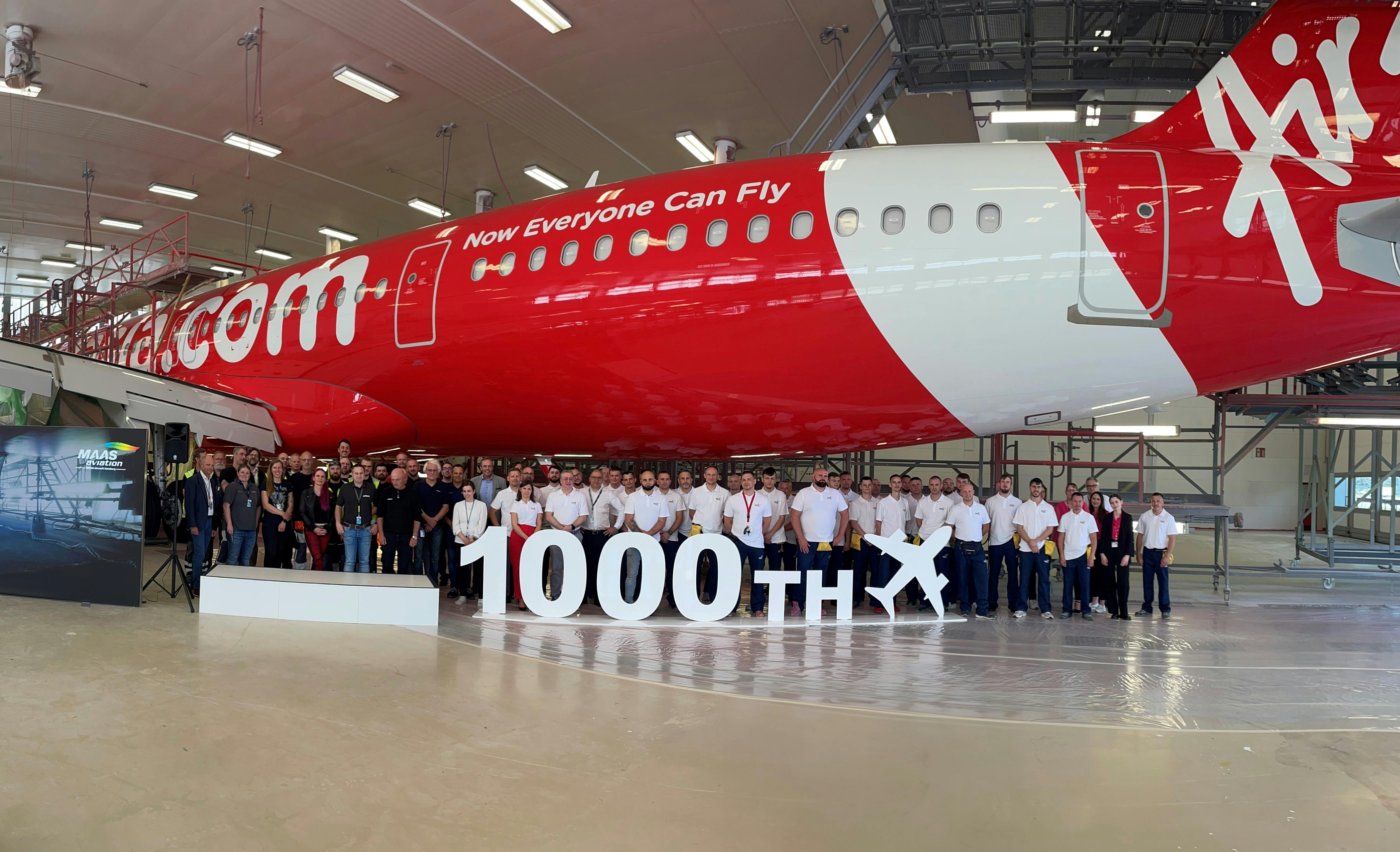 MAAS Aviation and Airbus teams celebrate delivery of the 1000th aircraft livery painted at the MAAS Hamburg paint shops, May 2024.