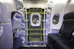A panel has been removed that covered the door plug on a Boeing 737-9 Max parked near an Alaska Airlines hangar at SEA on Jan. 11, 2024. Four bolts and 12 stop fittings hold the door plug in place. A panel has been removed that covered the door plug on a Boeing 737-9 Max parked near an Alaska Airlines hangar at SEA on Jan. 11, 2024. Four bolts and 12 stop fittings hold the door plug in place.