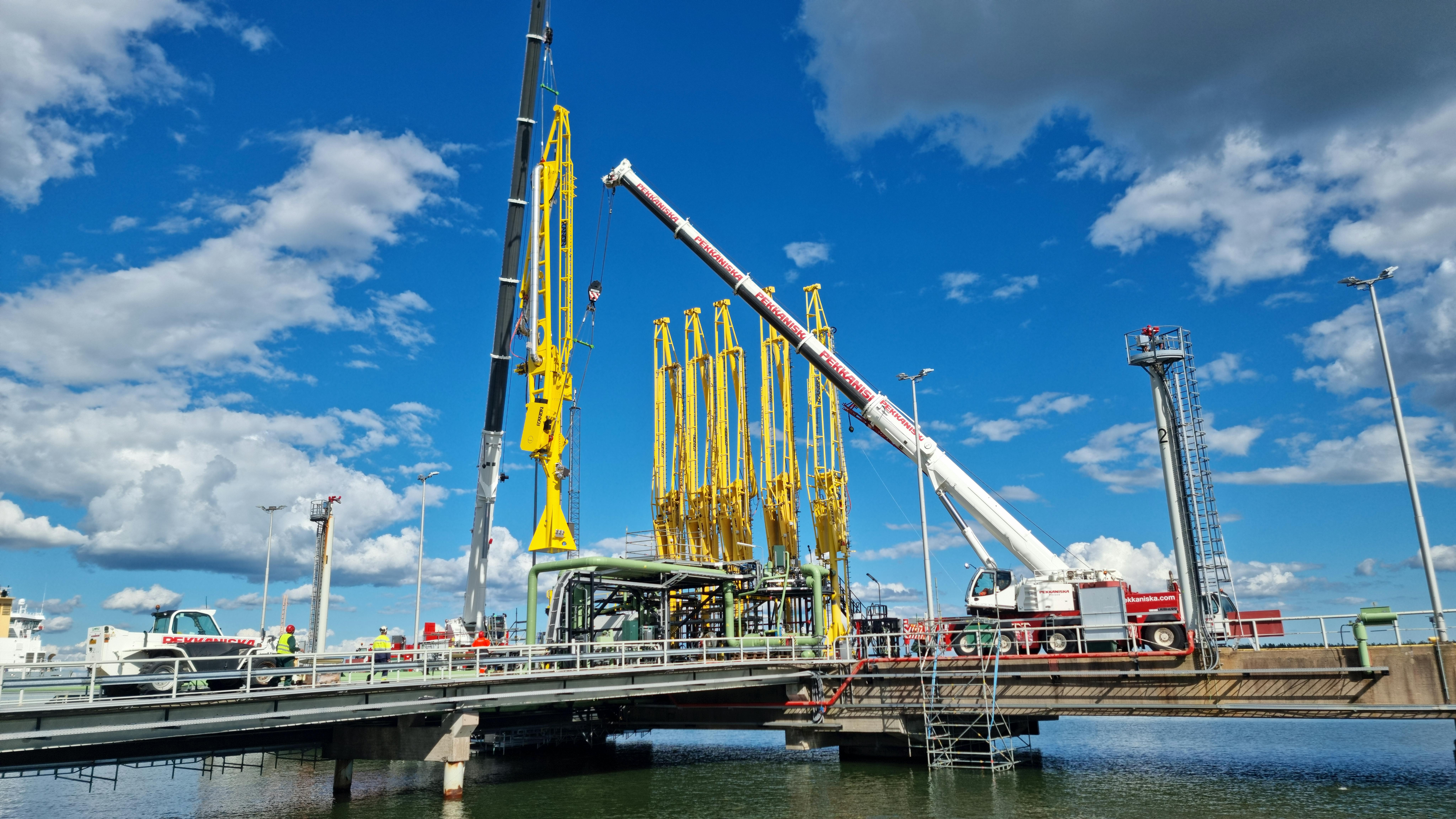 Installation of new unloading arm for liquefied recycled raw materials at Neste Porvoo refinery harbor, Finland.