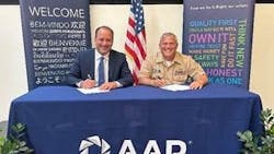Frank Landrio, AAR’s Senior Vice President of Distribution, and Captain Dale Haney, Defense Logistics Agency Director of Maritime Operations, meet in Wood Dale, Illinois, for a signing ceremony.