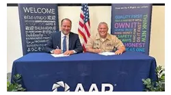 Frank Landrio, AAR’s Senior Vice President of Distribution, and Captain Dale Haney, Defense Logistics Agency Director of Maritime Operations, meet in Wood Dale, Illinois, for a signing ceremony.